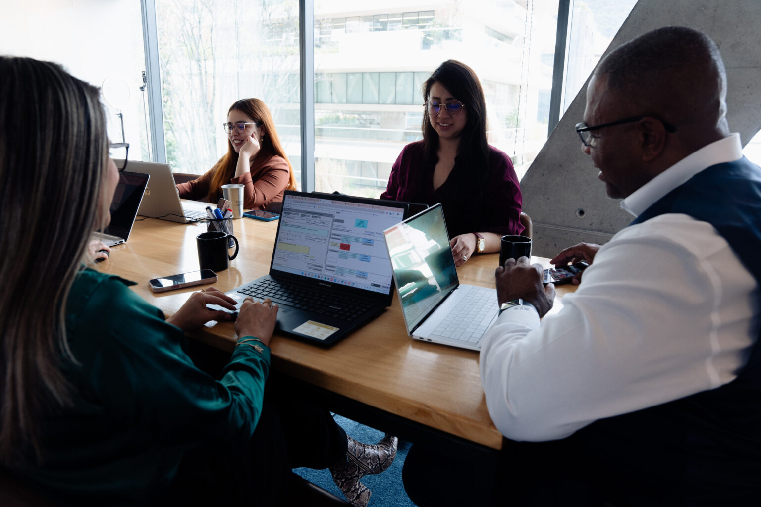 Get a Free Mental Health Billing Quote 1 Michael Williams, founder of MCM South Medical Billing Service, meeting with the billing team to review a practice's billing